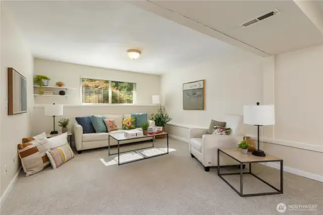 Huge great room in the lower level with access to beautiful backyard.