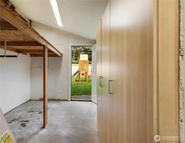 No more lawn mower in your garage! This very convenient added space just off the garage has access to the backyard.