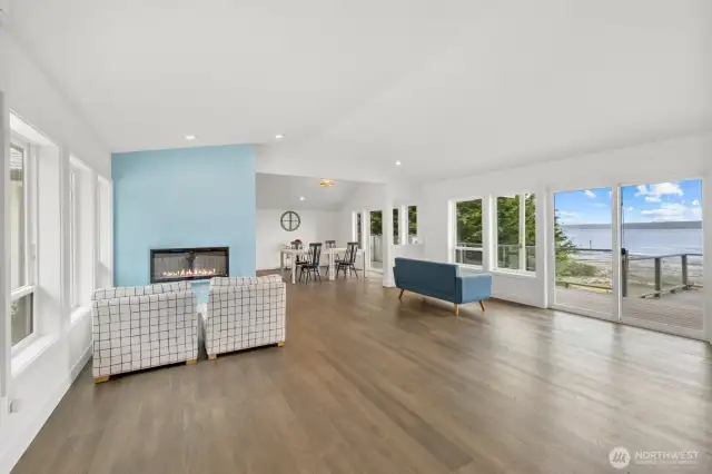 Open Living area with vaulted ceiling and water views