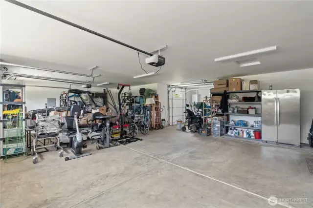3 car garage with 4th lawn mower garage door