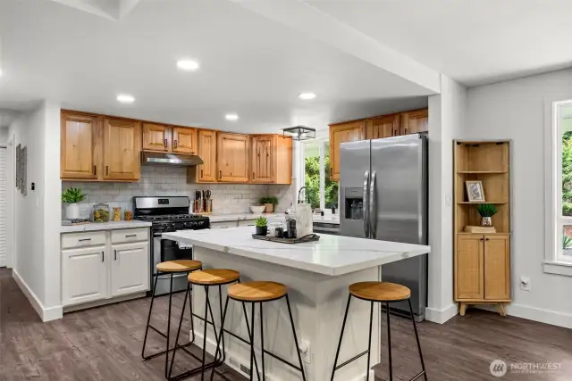 The heart of the home shines in this light and bright kitchen, meticulously updated in 2024