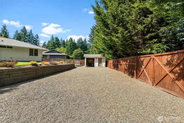 Gated double doors provide easy access to the backyard and shed.