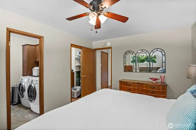 Primary bedroom view showing the laundry and walk in closet