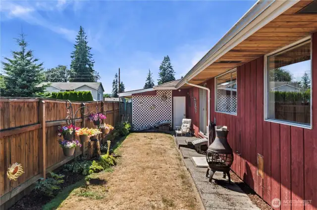 Side Yard and door to entrance to Garage