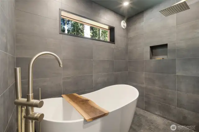 Primary bath with soaking tub and rainfall shower head