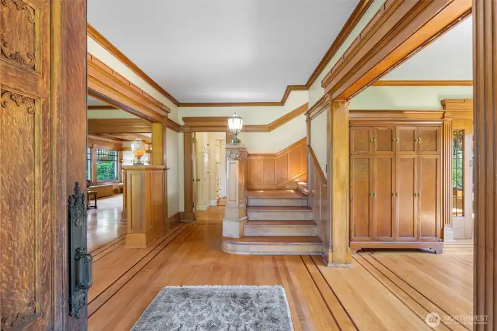 Main floor features a circular floorplan; to the right in this photo is the parlor, to the left the formal living room. Straight ahead is the kitchen or stairs to the bedrooms.