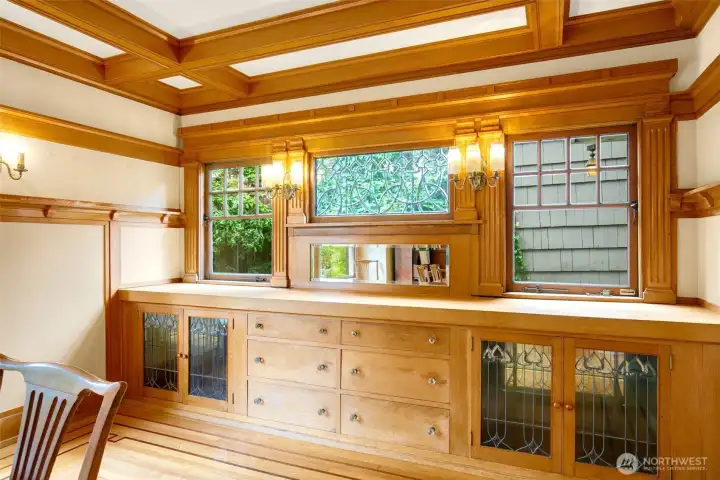 Honey colored built-ins anchor the dining room.