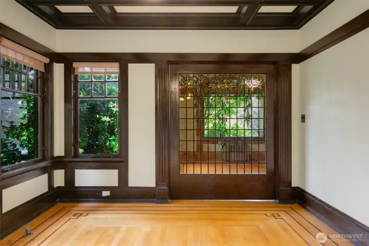 Gorgeous stained glass pocket door to enclose the Informal/TV room on the main floor.
