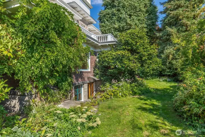 Amazing garden space surrounding the home. This shows the direct access to the ADU/Lower level living.