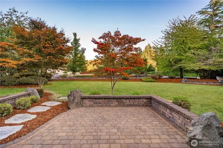 Extensive, custom rock-work and paving throughout