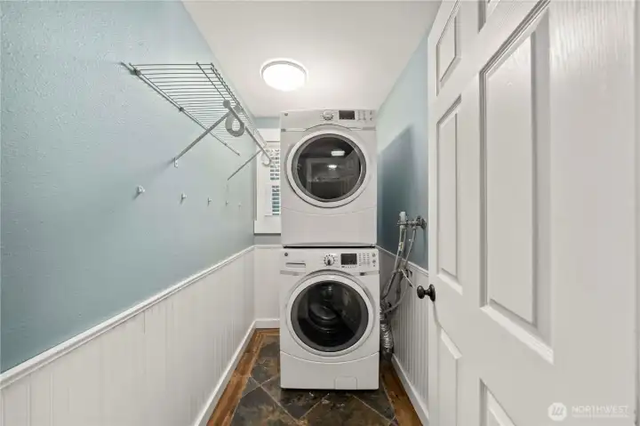 The laundry room is on the main floor and features a convenient laundry chute