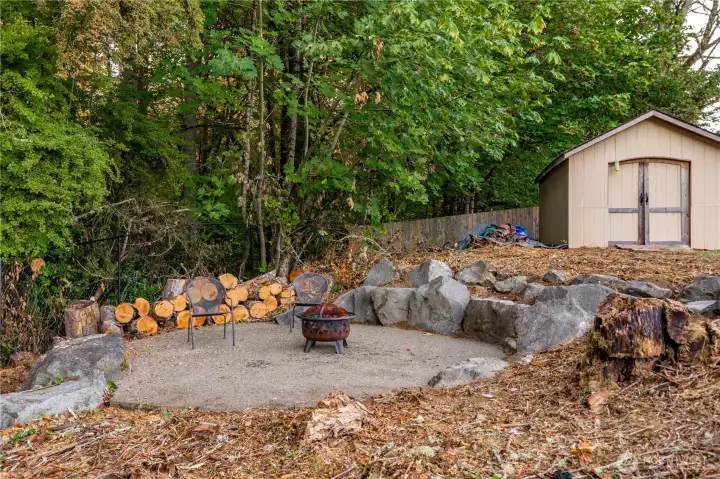Enjoy Smores at the sunken fire pit, backing to the wooded greenbelt. A convenient storage shed is nearby