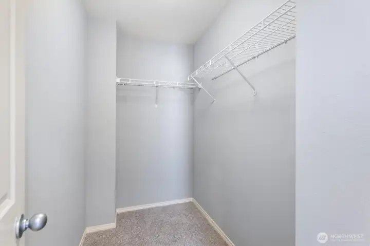 Primary bedroom walk-in closet