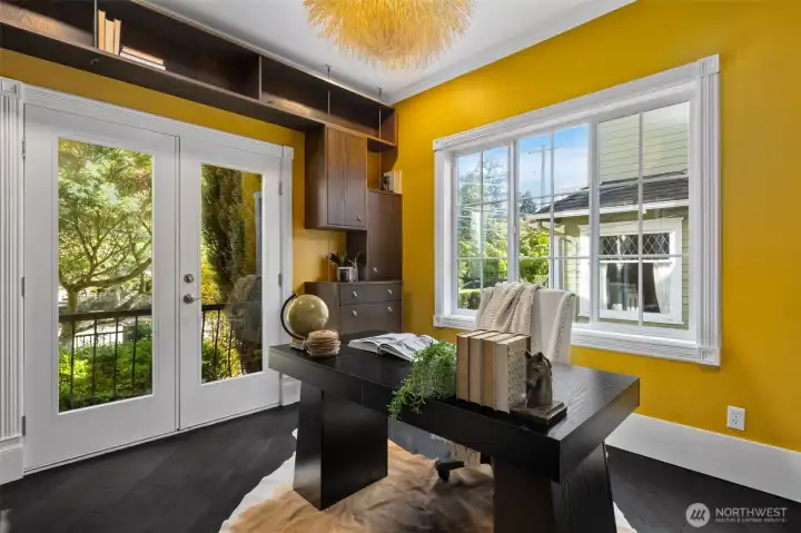 Sunlit home office/den with french doors and Juliet balcony