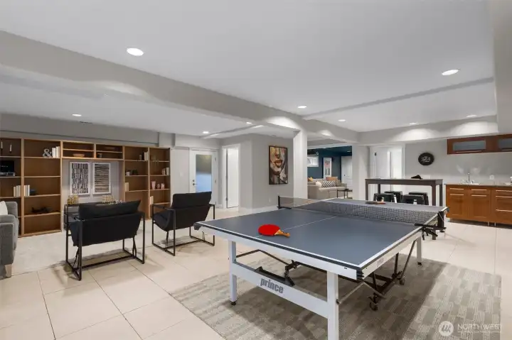 A spacious family room anchors the floor, with ample room to create distinct zones for games, crafts, or a stylish flex space tailored to your lifestyle.