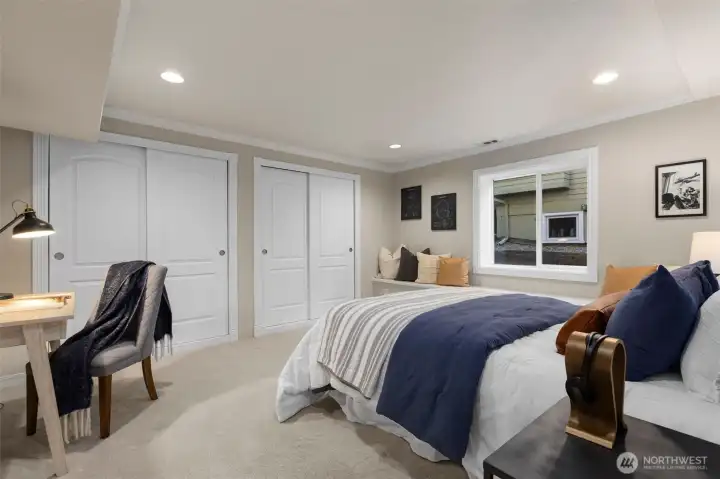 An inviting guest suite with a full bathroom provides comfort and privacy for visitors, extended family, or live-in support.