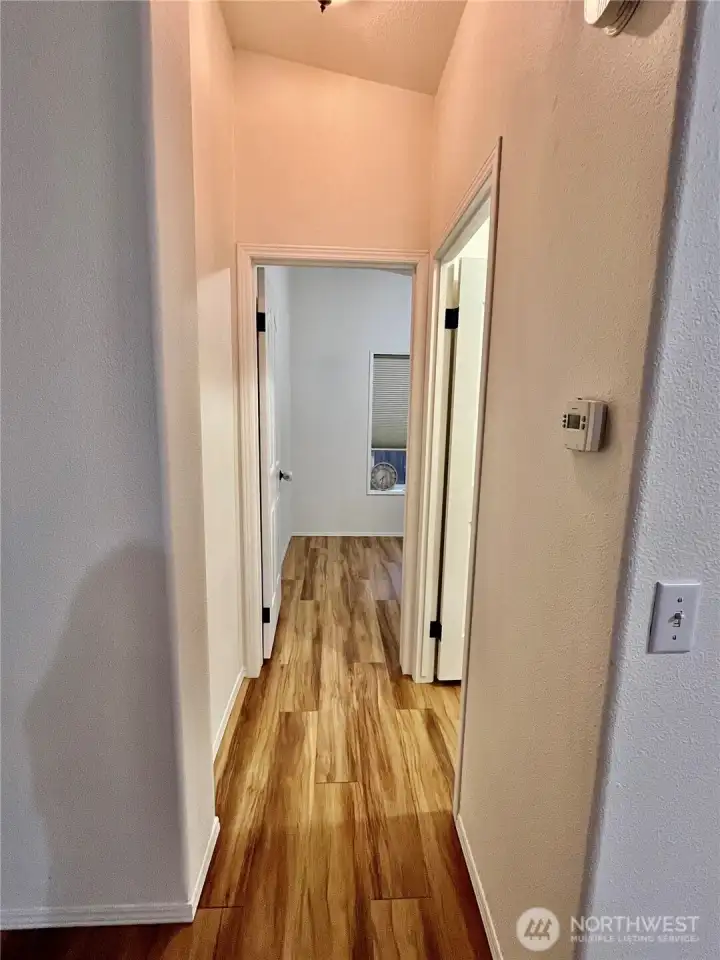 Hall leading to 3rd bedroom and 2nd full bath