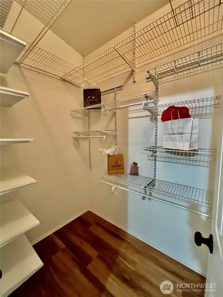 Primary bedroom walk in closet