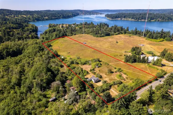 Nestled on more than 10 sunny, pastoral acres on scenic Maury Island...
