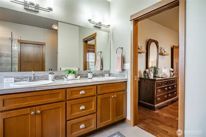 Primary bathroom with double sinks, soaking tub, walk-in shower.