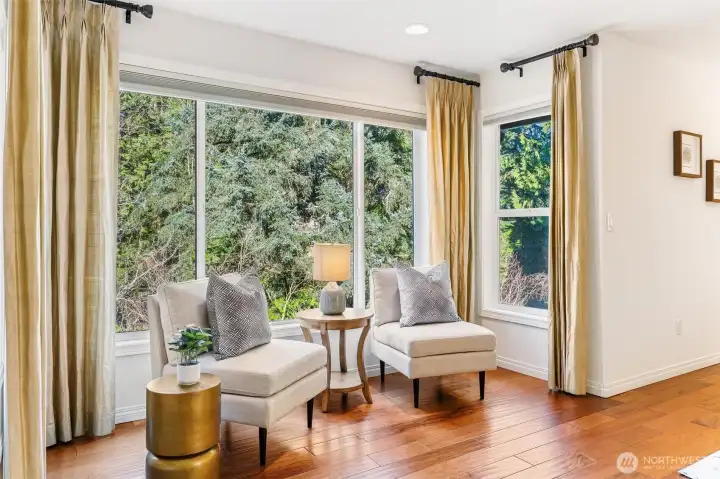 Bedroom Sitting Area space with large windows providing forest views