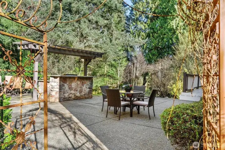 Walk through arbor to private backyard with BBQ, Firepit, pond, garden beds and sport court!