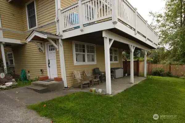 The lower unit has its own private entrance and patio just off the parking area.