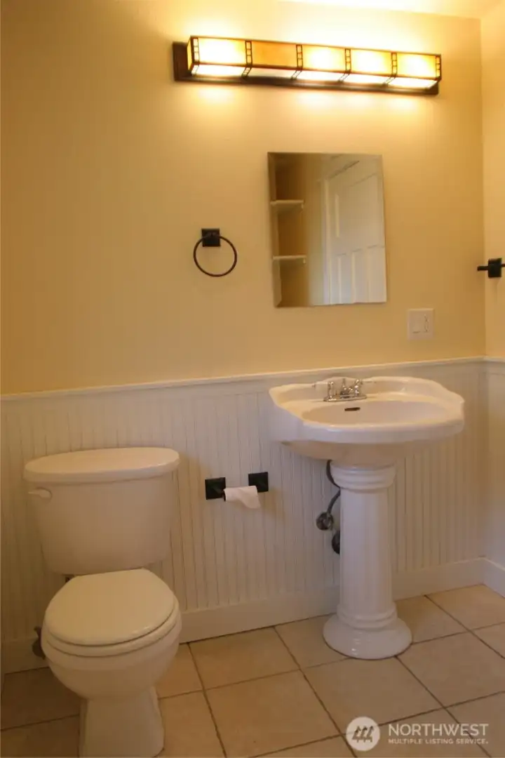 Full bathroom in the lower level unit.
