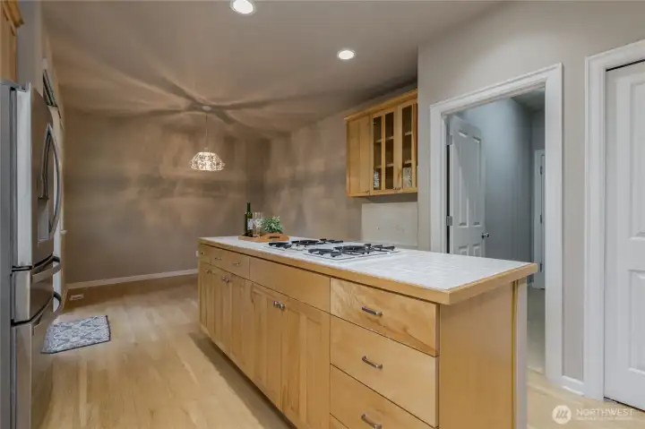 Abundant storage with this center island. Doorway leads to the laundry room and garage.