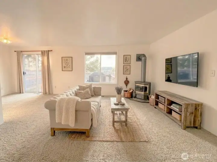 Cozy Living Room with propane stove. Virtually staged
