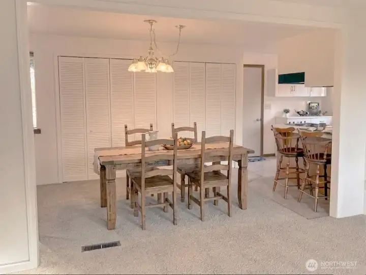 Dining area open to Kitchen and Living Room. Virtually staged