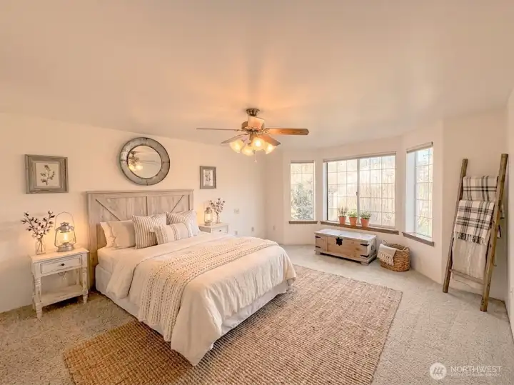 Large Primary Bedroom with walk in closet and Full Bath. Virtually staged