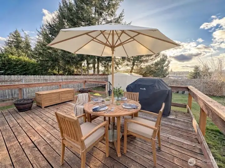 Large deck. Lots of room for BBQ, outside furniture & flower pots. Virtually staged.