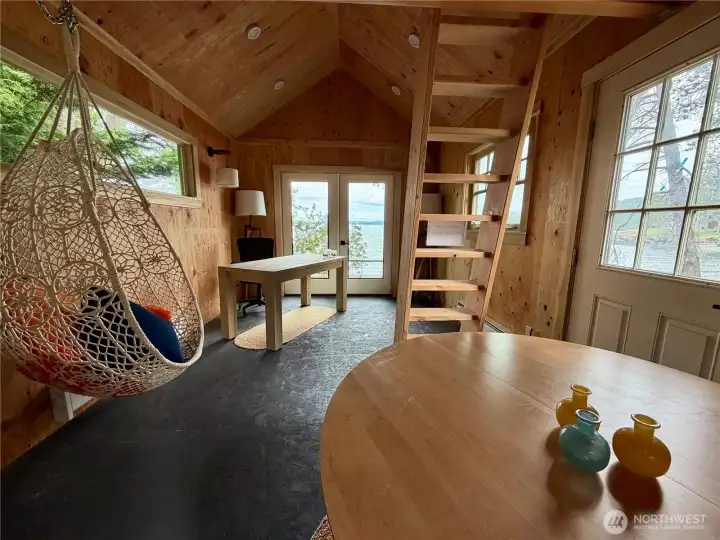 Boat house makes a great office, yoga studio, guest house with sleeping and storage loft. Has a connected composting toilet and is ready for outdoor shower installation.