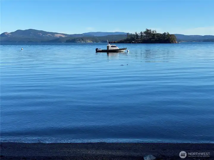 An annually inspected, permitted mooring buoy sits just offshore in approximately 50 feet of water, offering convenient access to the bay and surrounding San Juan Islands, including Jones Island Marine State Park.