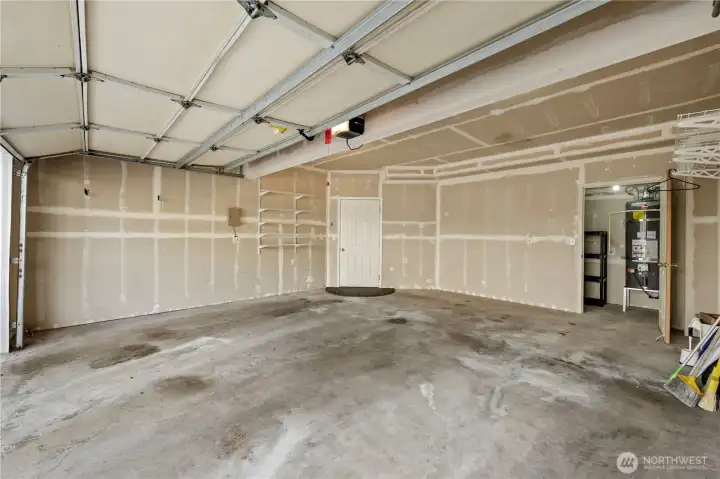 Large 2 car garage with storage room in the back