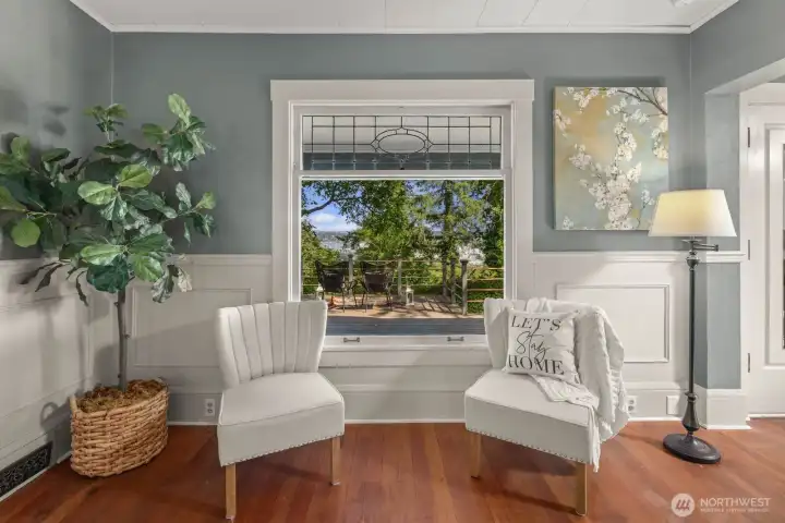 Original stained glass frames this area of the family room allowing for additional light and a beautiful view of the back yard.