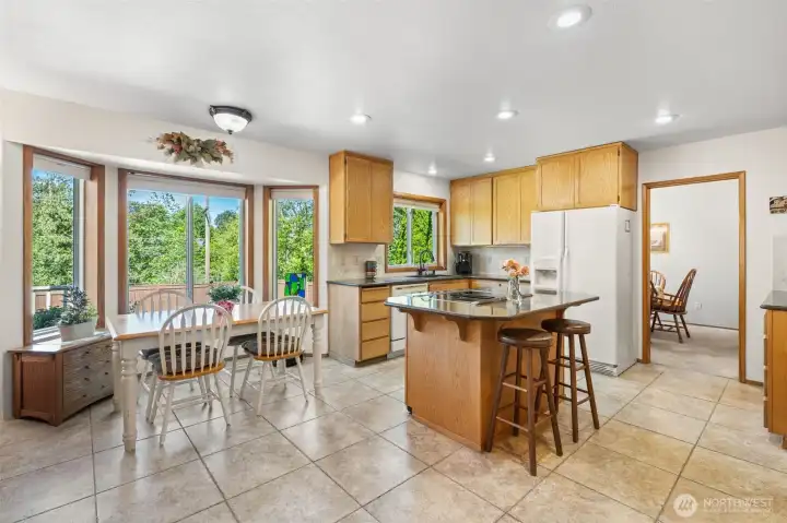Expansive kitchen with eating area Expansive kitchen with eating area