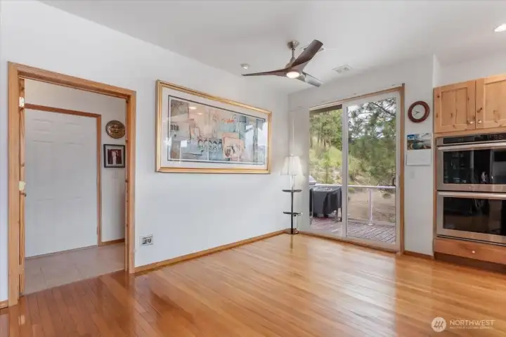 Additional area by kitchen for table or couch, leads to laundry