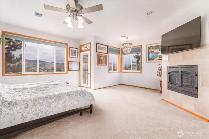 Primary bedroom- lake views, fireplace