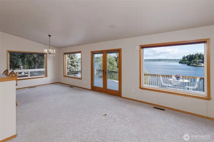 More of the front room - this is the dining area, with French doors leading out to the large deck. Kitchen is to the left. More of the front room - this is the dining area, with French doors leading out to the large deck. Kitchen is to the left.