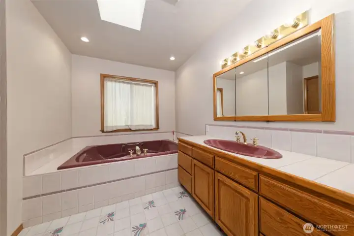 Primary bathroom with huge jetted soaking tub, and a step-in shower with a bench to sit on. Primary bathroom with huge jetted soaking tub, and a step-in shower with a bench to sit on.