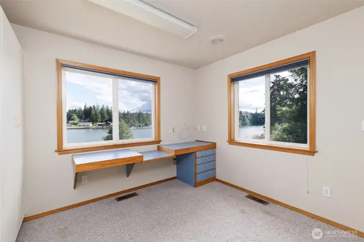 One of the bedrooms with a fantastic view and built-in desk and storage area. One of the bedrooms with a fantastic view and built-in desk and storage area.