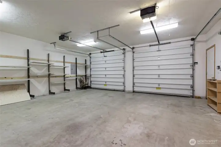 Beautiful big garage with lots of storage shelving. Beautiful big garage with lots of storage shelving.
