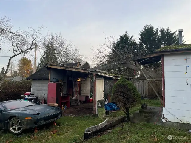 Cars will be removed. Carport is falling down, but the storage structure is solid!