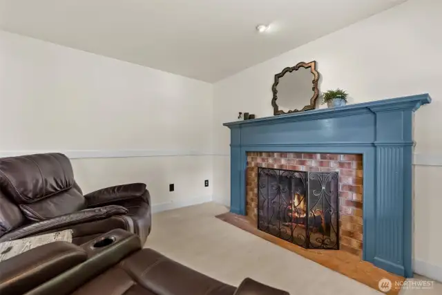 Cozy sitting area with fireplace—perfect for relaxing evenings.