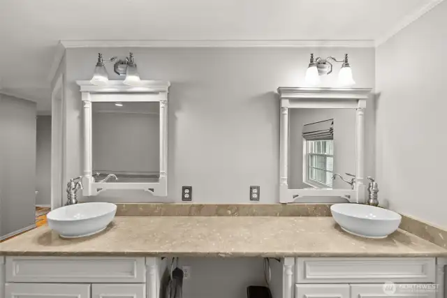 Beautiful vanity space with dual sinks and modern lighting.