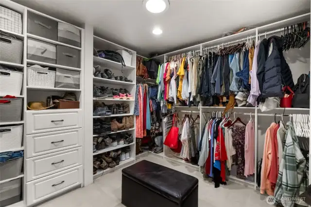 Custom walk-in closet with built-in organizers and storage.