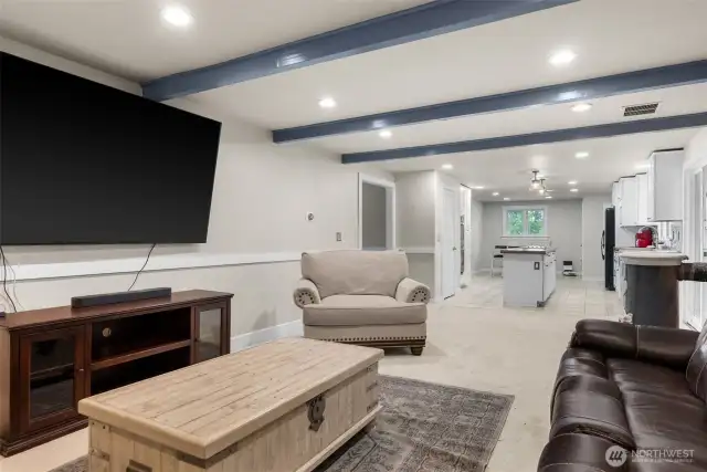Bright and inviting family room with original beams.