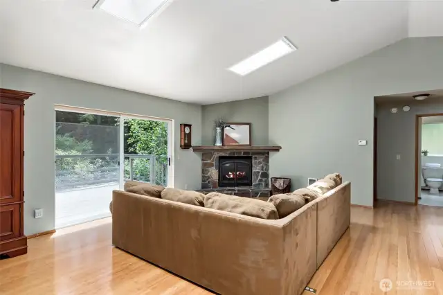 Large slider to the sunny back deck allows for plenty of light and easy access to the lovely outdoors!